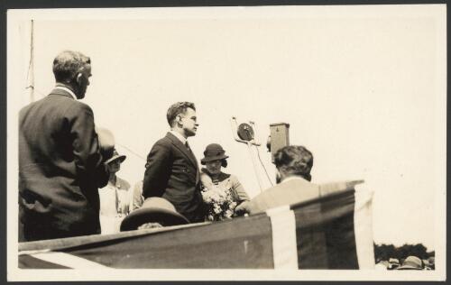 Charles Ulm and Mrs. Jo Ulm on dais during welcome at New Plymouth, New Zealand, 4 December 1933 [picture]