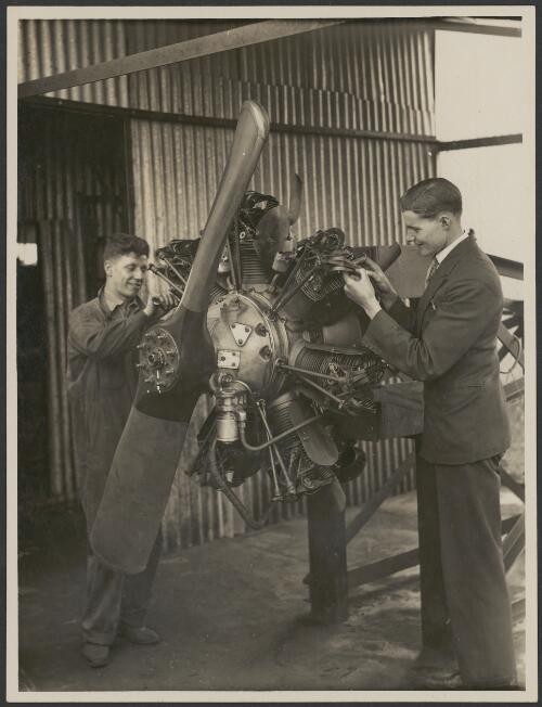 Australian National Airways engine foreman J.W. Palmer and a mechanic working on Lynx aircraft engine, ca. 1931 [picture] / J.T. Harrison