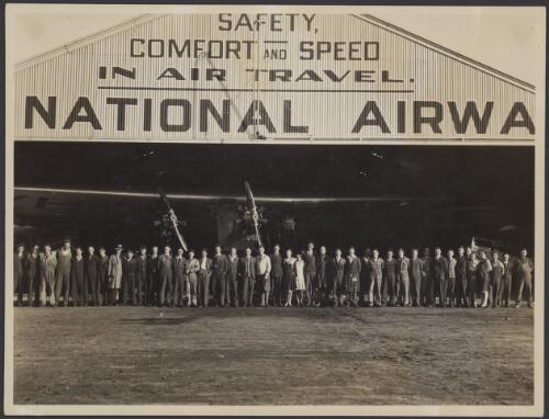 Staff of Australian National Airways posing in front of hangar, ca. 1929 [picture] / J. T. Harrison