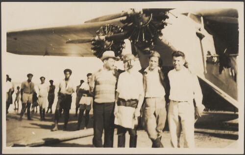Portrait of James Warner, Charles Kingsford Smith, Charles Ulm and Harry Lyon in front of The Southern Cross plane before leaving Suva, June 1928 [picture]