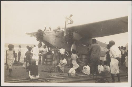 Fijians observing refuelling of The Southern Cross plane at Naselai Beach, Fiji, 7 June 1928 [picture]