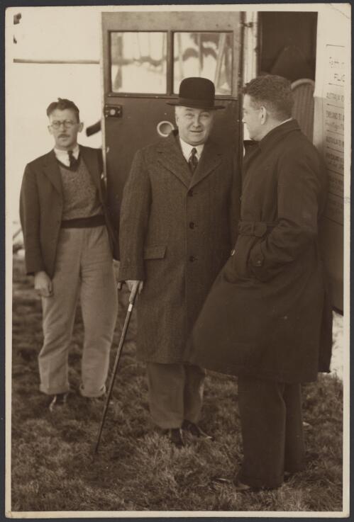 Portrait of Prime Minister J.A. Lyons and Charles Ulm by door of Faith in Australia plane VH-UXX, 1934 [picture]