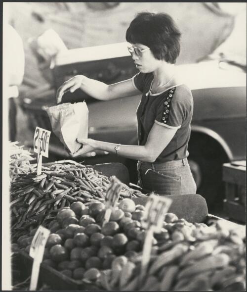 Woman at Victoria Market, Melbourne, ca. 1975, 2 [picture] / Bruce Howard
