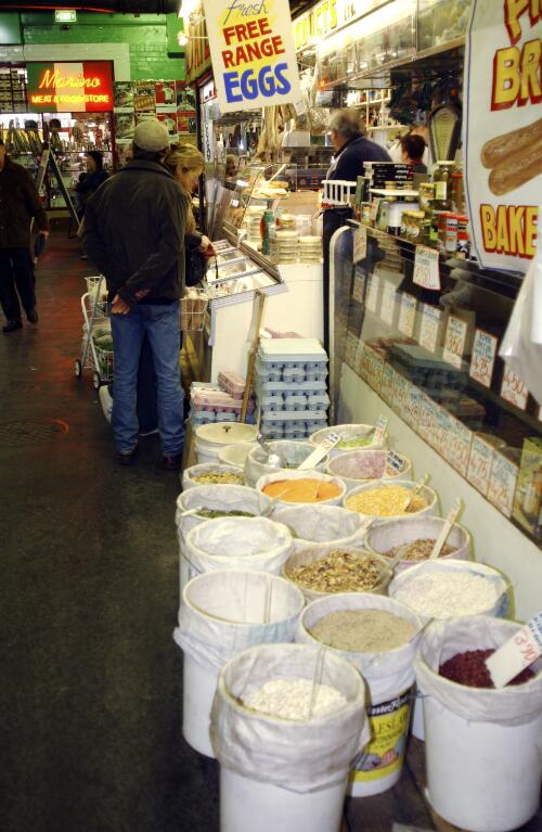 Open containers of pulses and legumes at the Central Market, Adelaide, 13 July, 2002 [picture] / Damian McDonald