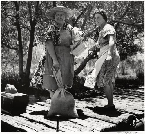 Two women collect their supplies on the upper reaches of the Hawkesbury River, New South Wales, ca. 1952 [picture] / Axel Poignant