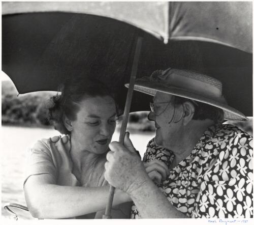 Two women shelter under an umbrella near Mangrove Creek, Hawkesbury River, New South Wales, ca. 1952 [picture] / Axel Poignant