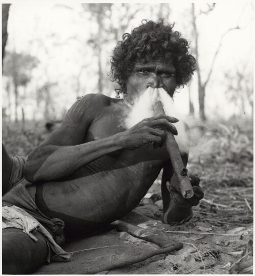 Narrana smoking a Macassan pipe, Liverpool River Region, Northern Territory, ca. 1952 [picture] / Axel Poignant