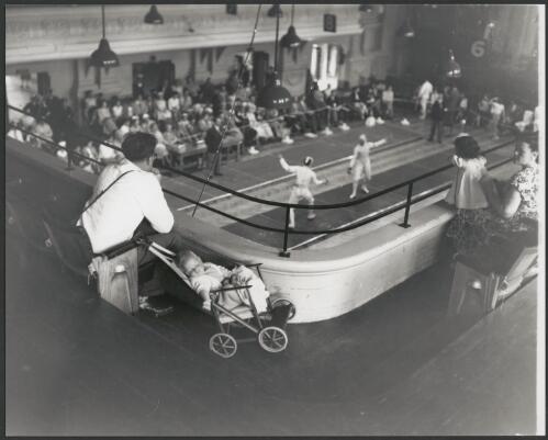 One of the fencing bouts between Italy and Hungary at St Kilda Town Hall during the Olympic Games, Melbourne, Victoria 1956 [picture] / Bruce Howard