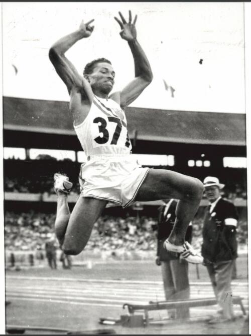 With a mighty leap Greg Bell of United States of America wins gold in the long jump at the Melbourne Cricket Ground, 24 November, 1956 [picture] / Bruce Howard