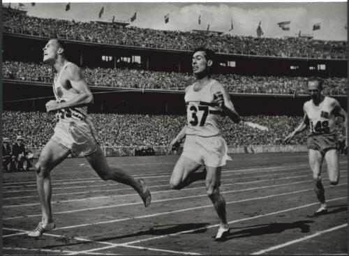 Tom Courtney of the United States wins the 800 metres final from D.J. Johnson of Great Britain and Northern Ireland and A. Boysen of Norway, Melbourne Cricket Ground, Victoria, Monday 26 November 1956 [picture] / Bruce Howard