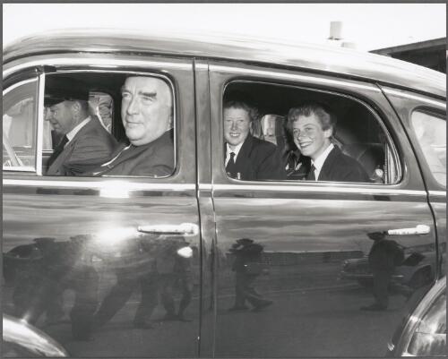 The Prime Minister of Australia, Sir Robert Menzies gives Betty Cuthbert and team mate Heather Innes a lift from the village to a function in the city, Melbourne, 27 November, 1956 [picture] / Bruce Howard