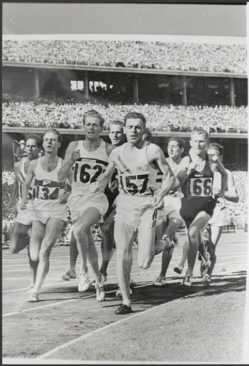 Bell lap in the 1500 metres final of the Olympics with Merv Lincoln of Australia in the lead and John Landy (Australia) at far left, Melbourne Cricket Ground, Victoria, November 1956 [picture] / Bruce Howard