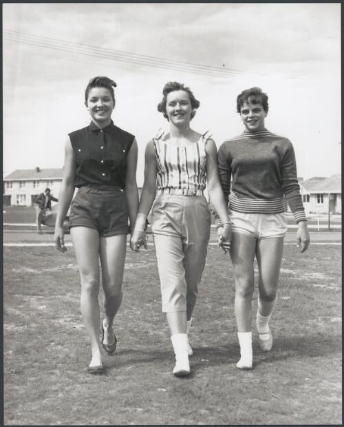 Stepping out at the Olympic Village are Muriel Davis, Judy Howe and Ingeborg Fuchs of the USA gymnastics team, Heidelberg, Victoria, 1956 [picture] / Bruce Howard