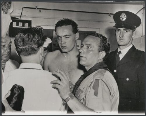 Ervin Zador of Hungary in the medical room after the water polo match, Melbourne, Victoria, 1956 [picture] / Bruce Howard
