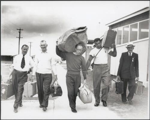 Some of the New Zealand athletes moving out of the Olympic village, Melbourne, 1956 [picture] / Bruce Howard