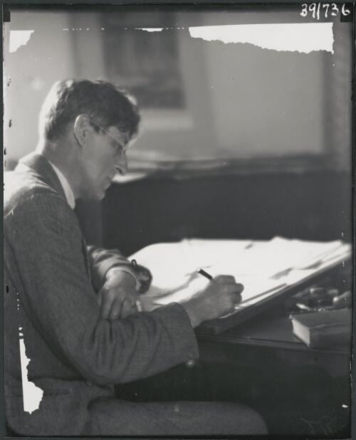 Hardy Wilson at his desk at Purulia, Warrawee, New South Wales, 1921, 2 [picture] / Harold Cazneaux