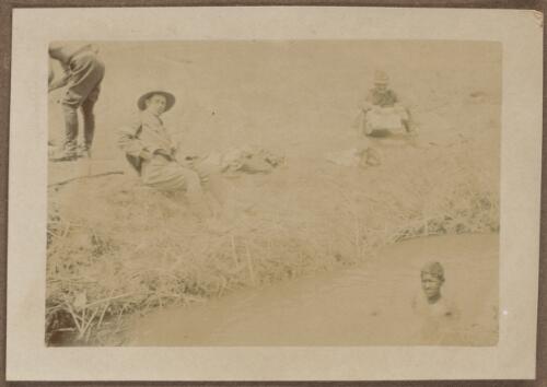 Soldiers sitting on the bank of a canal, Alexandria, Egypt approximately 1915 / W.A.S. Dunlop