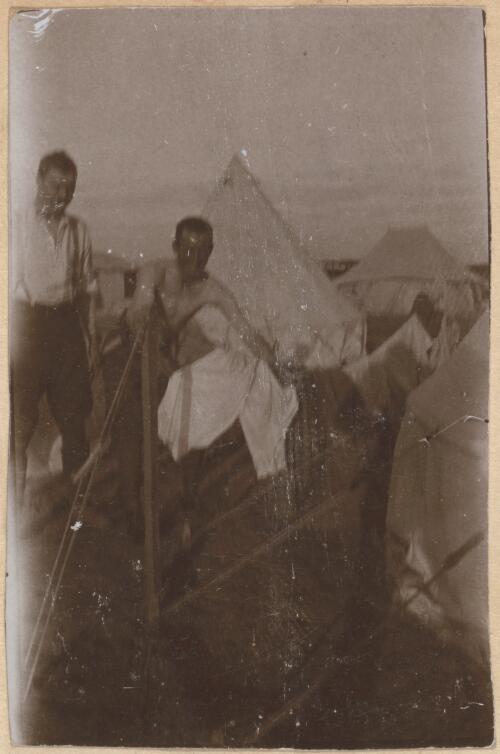 Soldiers washing themselves near tents, Mena Camp, Egypt, 1915 / W. A. S. Dunlop