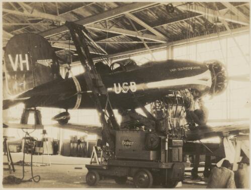 Aviation mechanics work on the Lady Southern Cross, a Lockheed Altair, at the Wheeler Field, Honolulu, Hawaii, 1934, 3 [picture]
