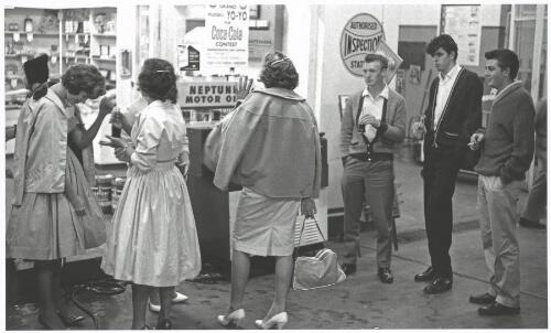 Three young men and three young women standing outside the service station beside the dance-a-thon, Caringbah New South Wales, 1961 [picture] / Jeff Carter