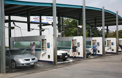 Owners washing their cars at a self service facility, Surrey Hills, Victoria, 2008 [picture] / June Orford