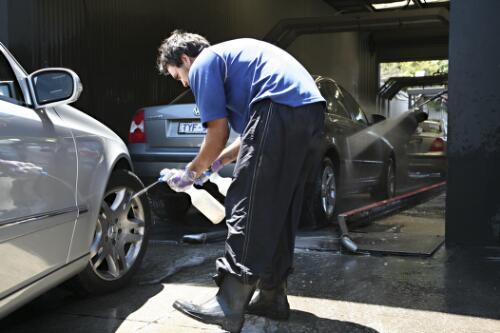 A car's wheels are sprayed with detergent as it enters the conveyor belt at Magic Hand car wash, Blackburn, Victoria, 2007 [picture] / June Orford