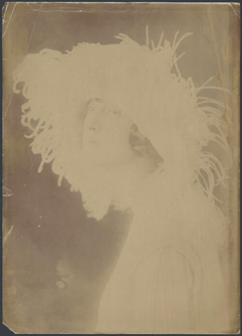 Portrait of Pixie Herbert wearing large feather trimmed hat ca. 1923 [picture]