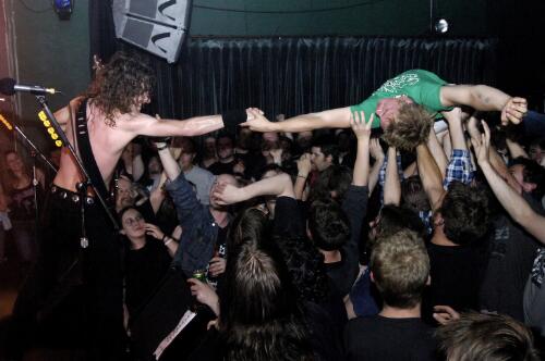 Young man crowd-surfing at a performance of Airbourne in East Brunswick Club, Melbourne, Victoria, 2006 [picture] / Martin Philbey