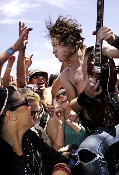 Airbourne performing for the crowd at the Pyramid Rock Festival, Phillip Island, Victoria, 2005 [picture] / Martin Philbey