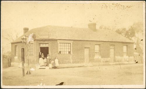 A family standing outside Hemen W. Vile factory [?], Hill End [?], New South Wales, ca. 1873 [picture] / Beaufoy Merlin