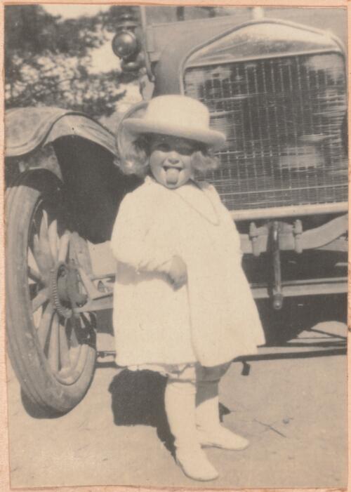 Joan Dunlop standing in front of a car, Lanyon, probably 1920 / W. A. S. Dunlop
