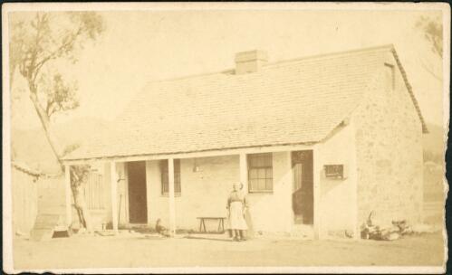 An elderly woman in front of whitewashed stone cottage, Hill End, New South Wales, ca. 1873 [picture] / Beaufoy Merlin