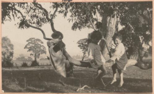 Three children playing in a tree in the garden at Lanyon, Canberra, 1922 / W. A. S. Dunlop
