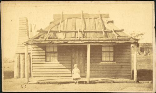 A young girl in front of a hut with bark roof, Gulgong, New South Wales, ca. 1872 [picture] / Charles Bayliss