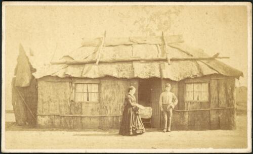 Woman and young man outside bark house, Gulgong, New South Wales, ca. 1872 [picture]
