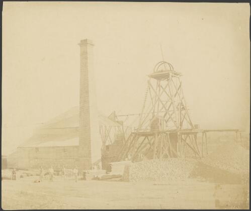 Large gold mine with seven men standing in front, Bendigo Region, Victoria, ca. 1872 [picture]