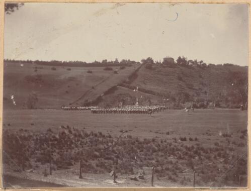 Boys lined up in the distance at Geelong Grammar school camp, Victoria?, approximately 1908 / W.A.S. Dunlop