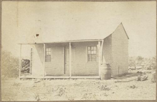Whitewashed cottage with corrugated iron roof, veranda and water barrel, Hill End region, New South Wales, ca.1872 [picture]