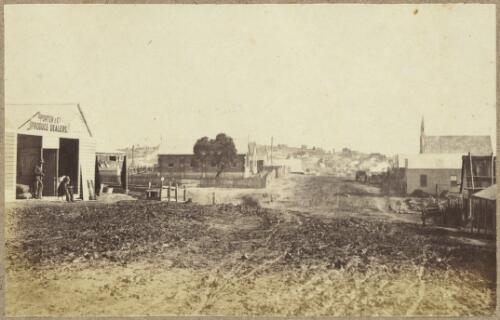 View of Tambaroora Street looking south, showing brick addition to the public school and the completed brick Presbyterian Church, with Porter & Co. Produce Dealers store left foreground, Hill End, New South Wales, ca.1872 [picture]