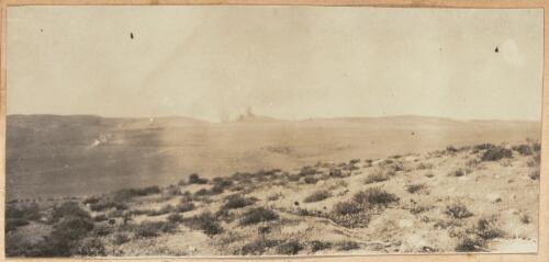 Distant view of the shelling of Turkish forces at Tel el Khuweilfe, southern Palestine, approximately 1917