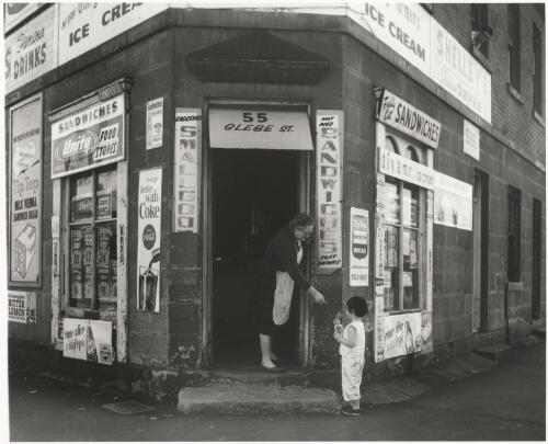 "Here is your change". Corner shop, 55 Glebe Street, Glebe, Sydney, 1964 [picture] / Raymond de Berquelle