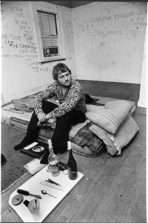 A squatter sits on a mattress in an old house in the suburb of South Yarra, a suburb of Melbourne, 1978 [picture] / Bruce Howard