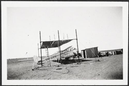 MacRobertson Miller Aviation de Havilland D.H.84 Dragon II passenger transport VH-UVN under hessian canopy at Ord River Station, Western Australia, ca. 1936 [picture]