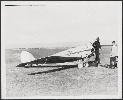 Dr R Cato (right) with his de Havilland DH53 Humming Bird monoplane on a field, 1937 [picture]