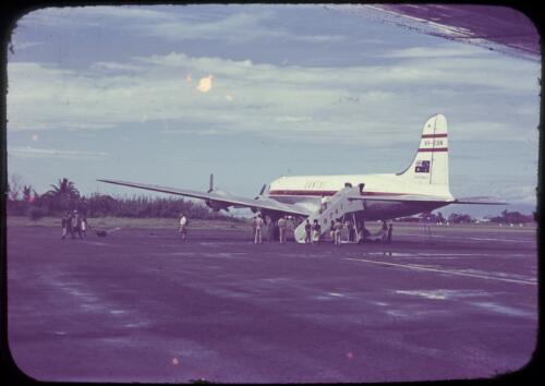 Qantas aircraft on the tarmac at Lae, between 1955 and 1960 [transparency] / Tom Meigan