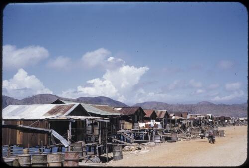 Native village, Port Moresby, 1955 or 1956 [transparency] / Tom Meigan