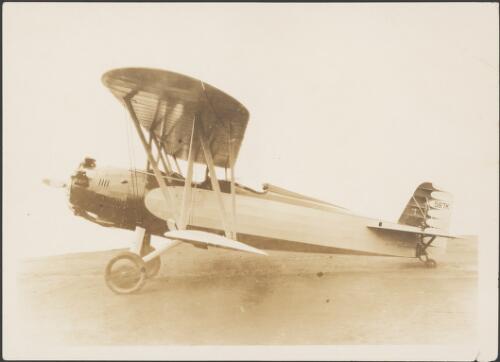 Boeing 203 biplane NC587K on a field, ca. 1930 [picture]