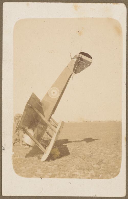 Side view of upturned Australian Flying Corps Sopwith Pup biplane C526 on a field at Wyton, England, 1917 [picture]