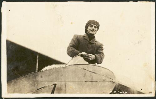 Portrait of Reg Carr in an aircraft cockpit at Hendon airfield, England, 1913 [picture]