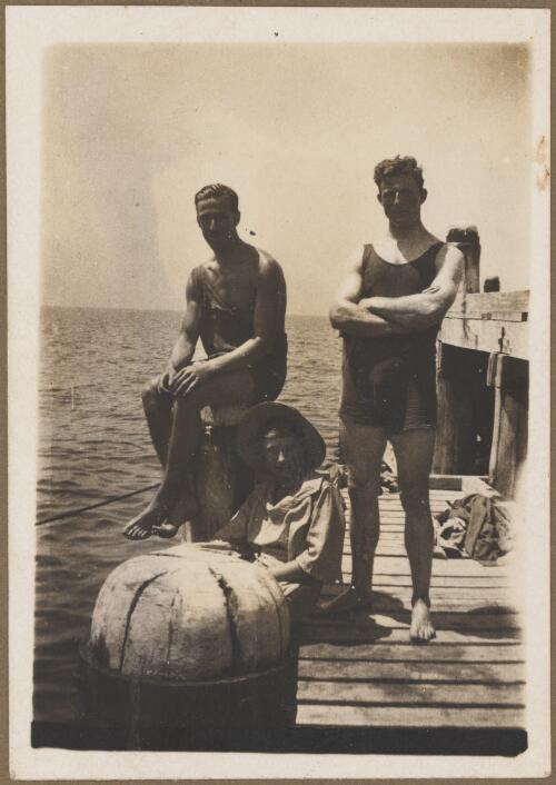 Horrie Miller (left) with a man and a woman in bathing suits on a jetty, Queensland, ca. 1923 [picture]